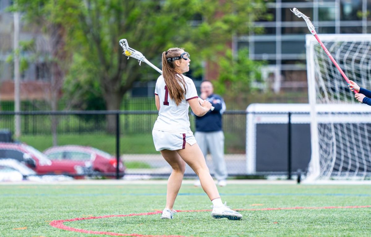 Senior Macey Mitchell controls the ball near midfield, looking to set up the next play for State High.
