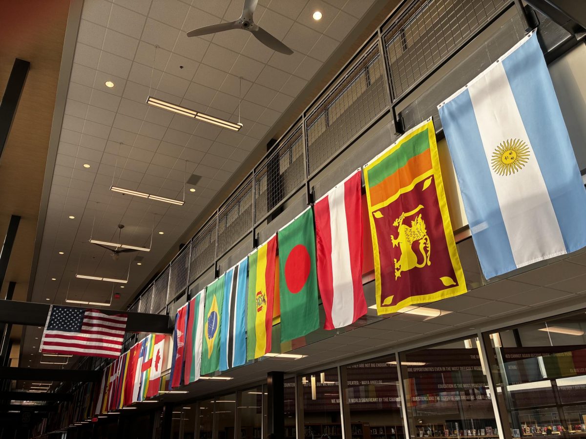 Flags of countries around the world hang in the main hallway in the State College Area High School building
