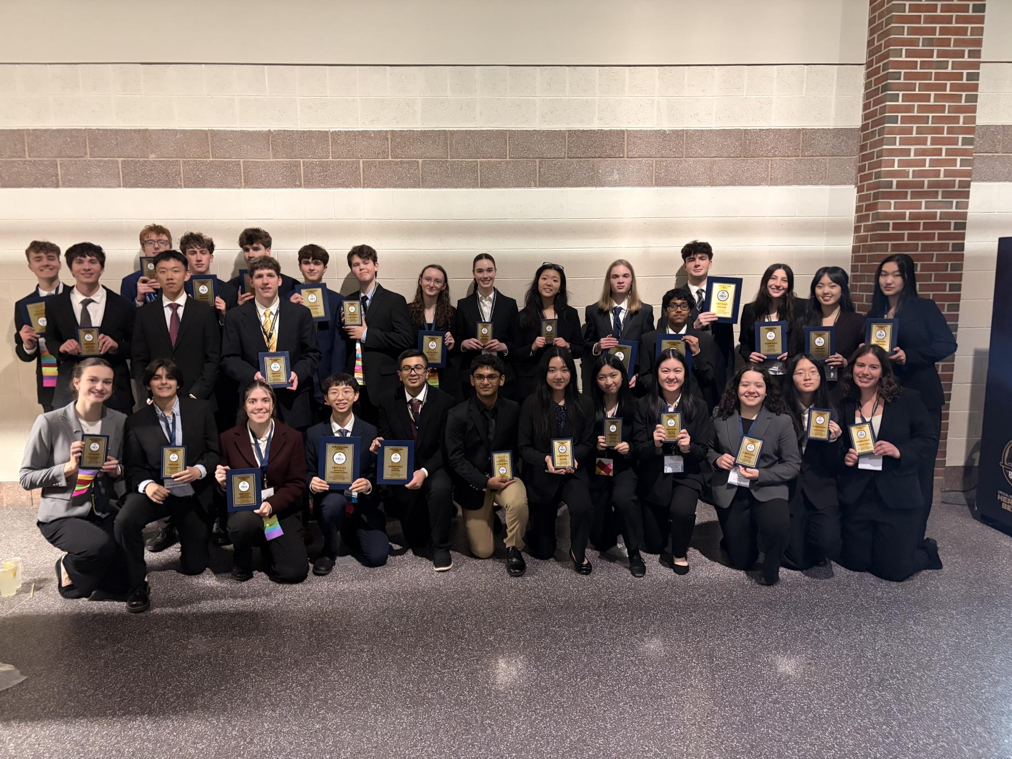 FBLA members pose for a picture holding their awards. Photo courtesy of Donovan Wales.