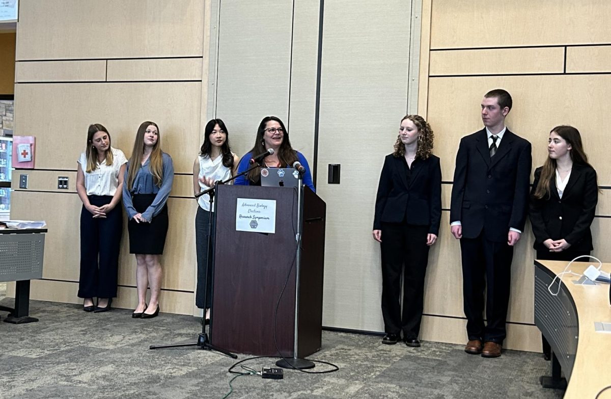 Danielle Rosensteel presents at the ABE Research Symposium alongside the ABE students. Photo courtesy of Danielle Rosensteel.
