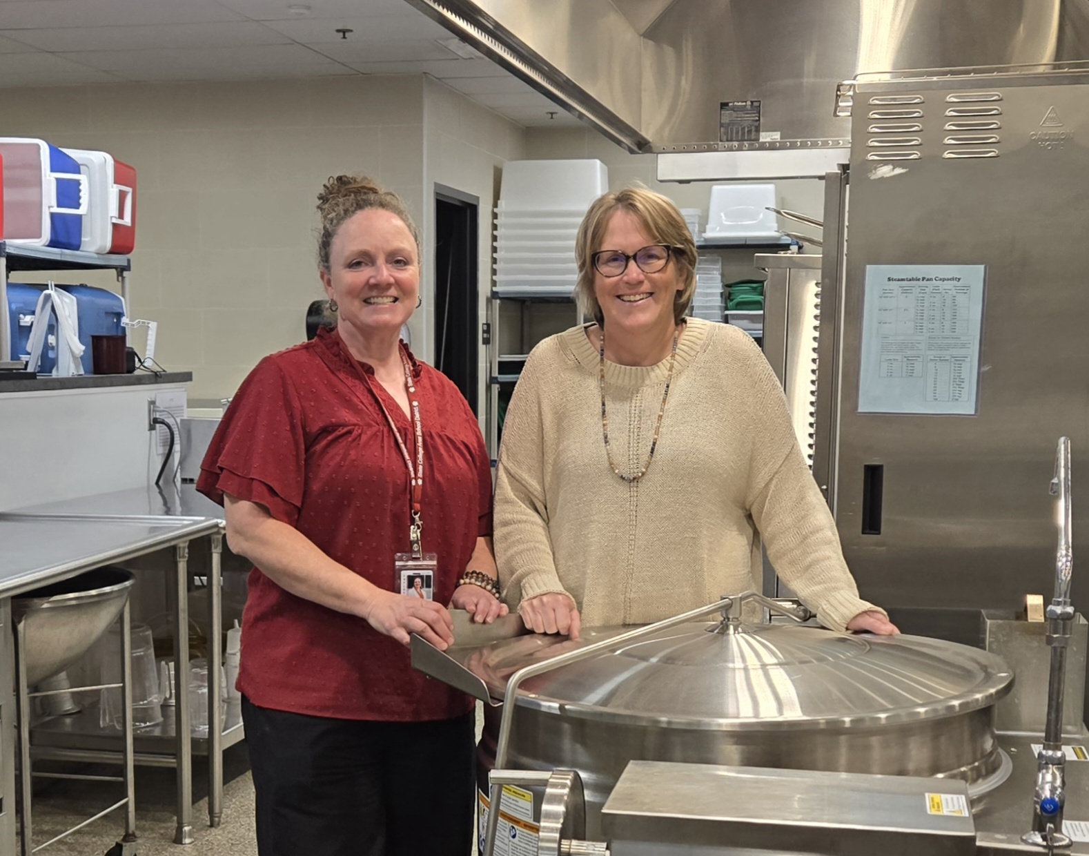 Future Food Service Director Marissa Schaeffer (Left) and Retiree Megan Schaper (Right) pose in the State College kitchens. The two have developed a close relationship, learning from each other while exchanging information and skills.
Photo Courtesy of Megan Schaper