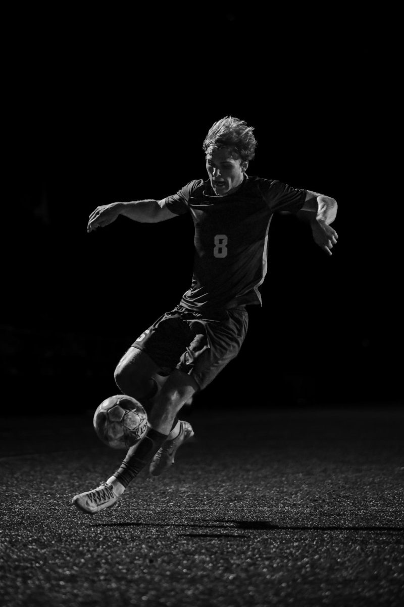 Senior Daniel Sahakian takes a touch during the boys soccer team's homecoming week game against Mechanicsburg.