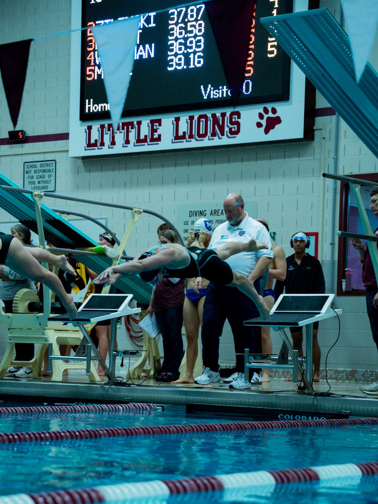 Molly Workman dives into the pool in a 2025 meet.