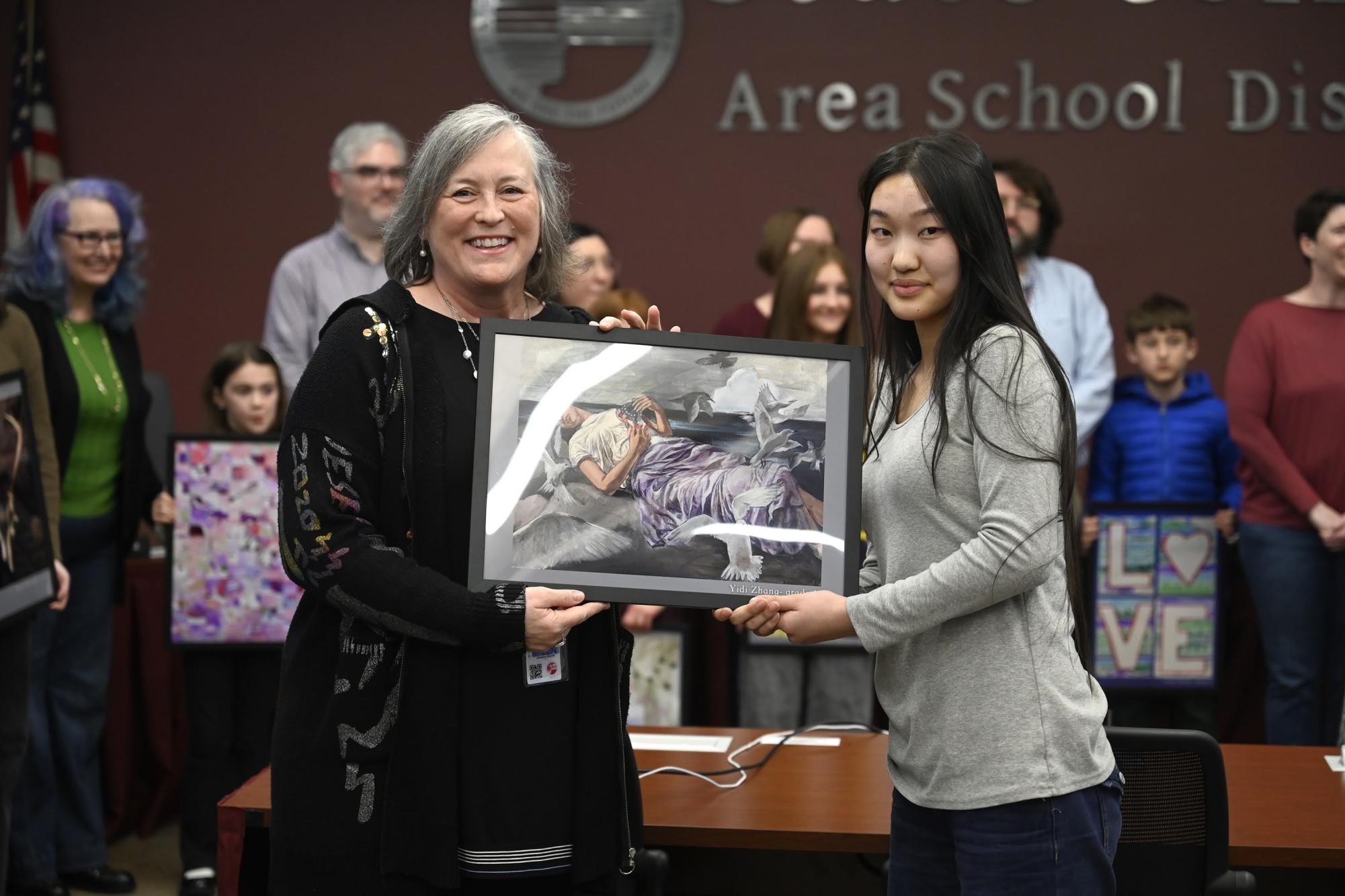 Christine Merritt poses with junior Yidi Zhang at a school board meeting.
Photo Courtesy of Nabil Mark.
