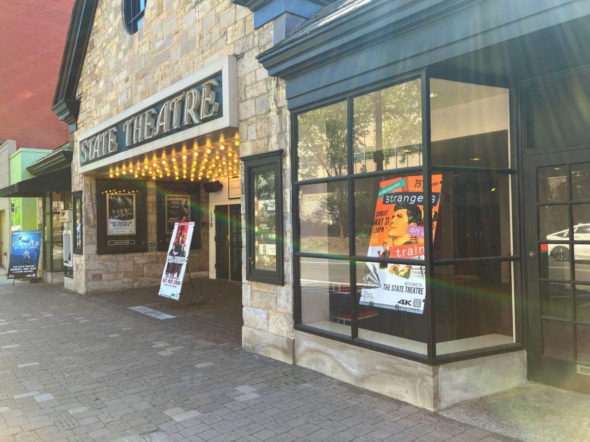 State Theatre on West College Ave advertises a movie showing. 