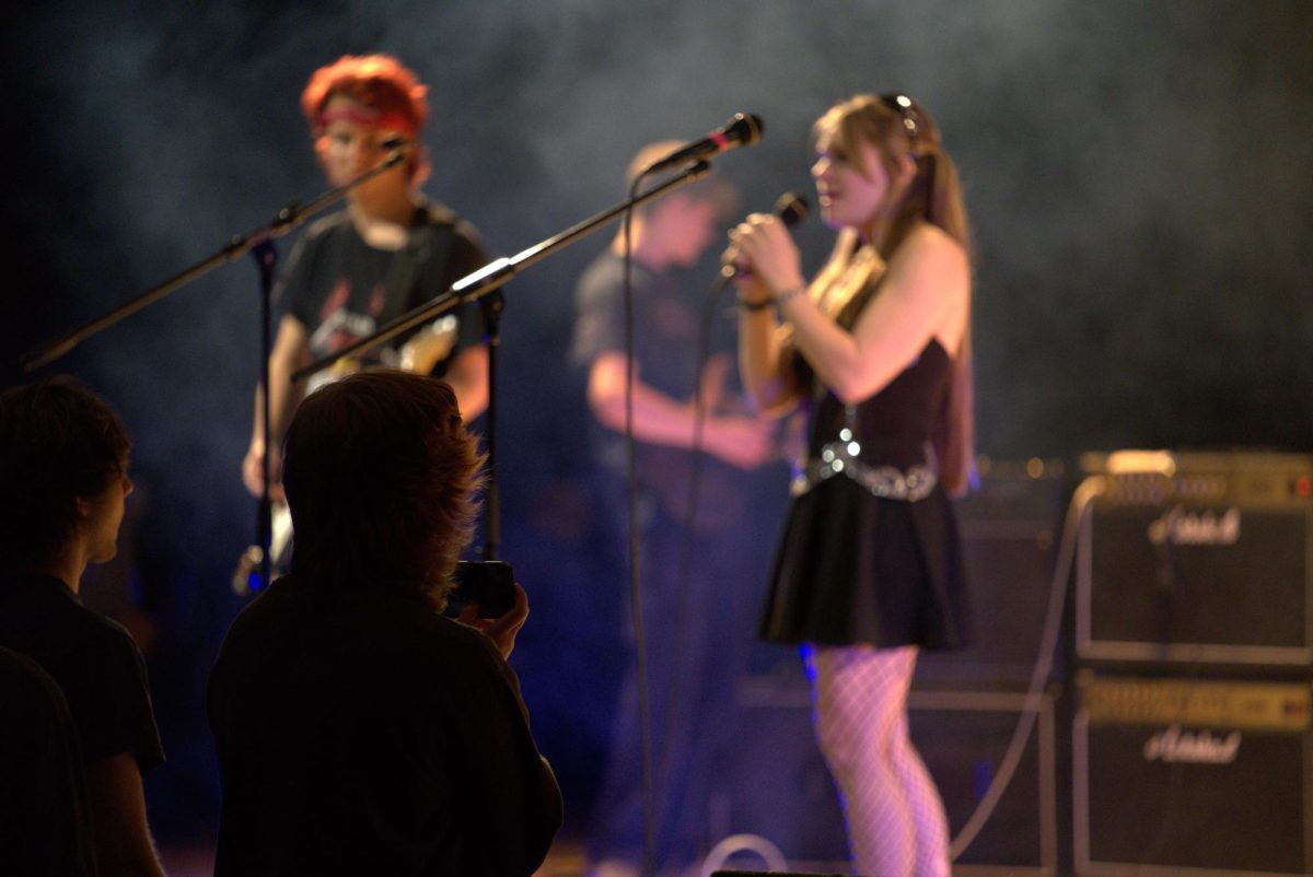 Seniors Stella Brannen and Graham Lowe harmonizing during "You Know What They Do To Guys Like Us In Prison" by My Chemical Romance.